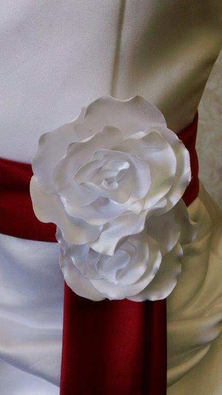 white dress with apple red sash